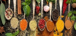 herbs and spices on spoons